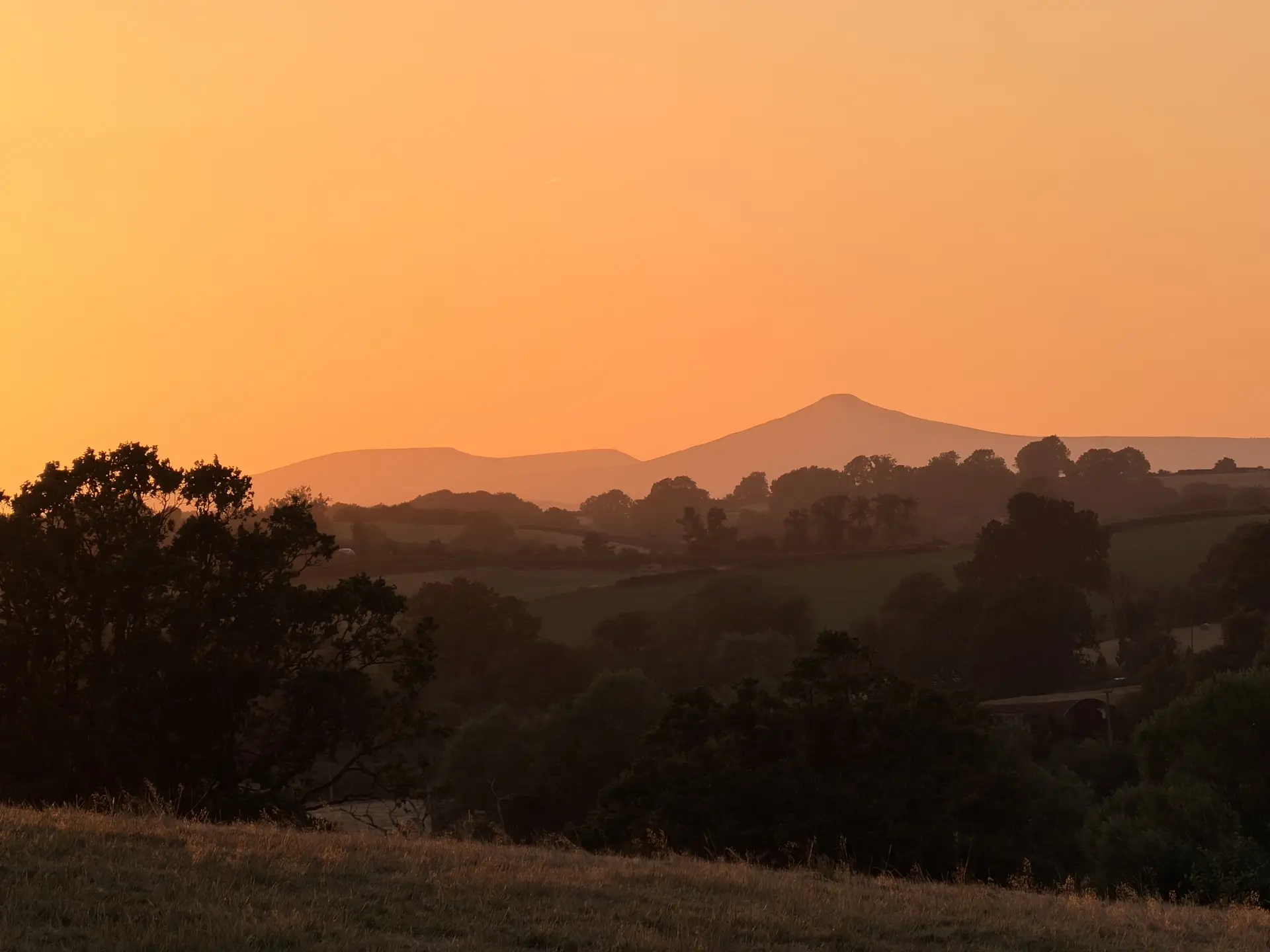 Rolling Brecon Beacons hills at golden hour